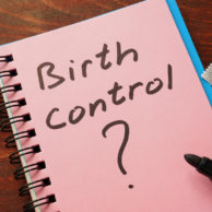 notepad with birth control written